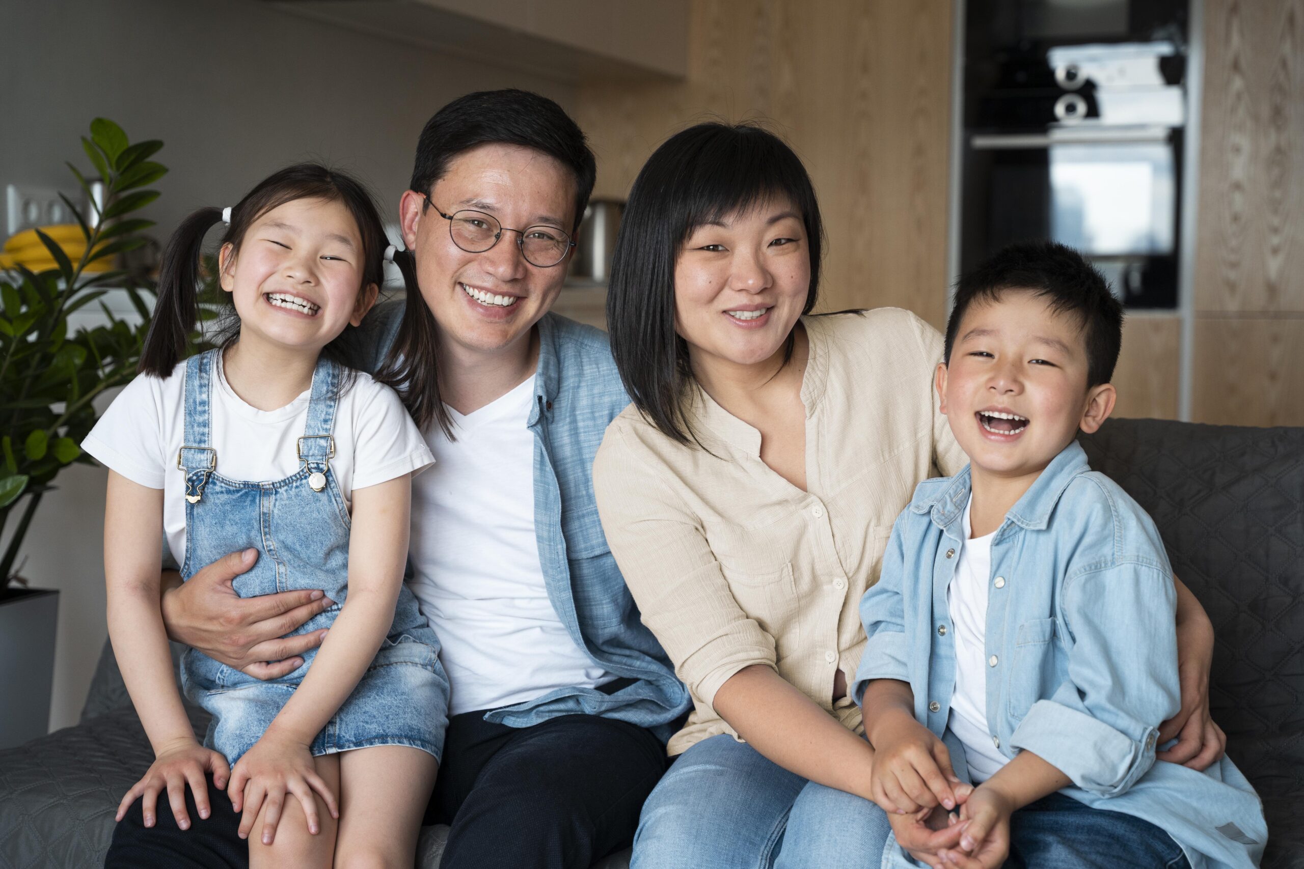 medium shot happy family posing scaled